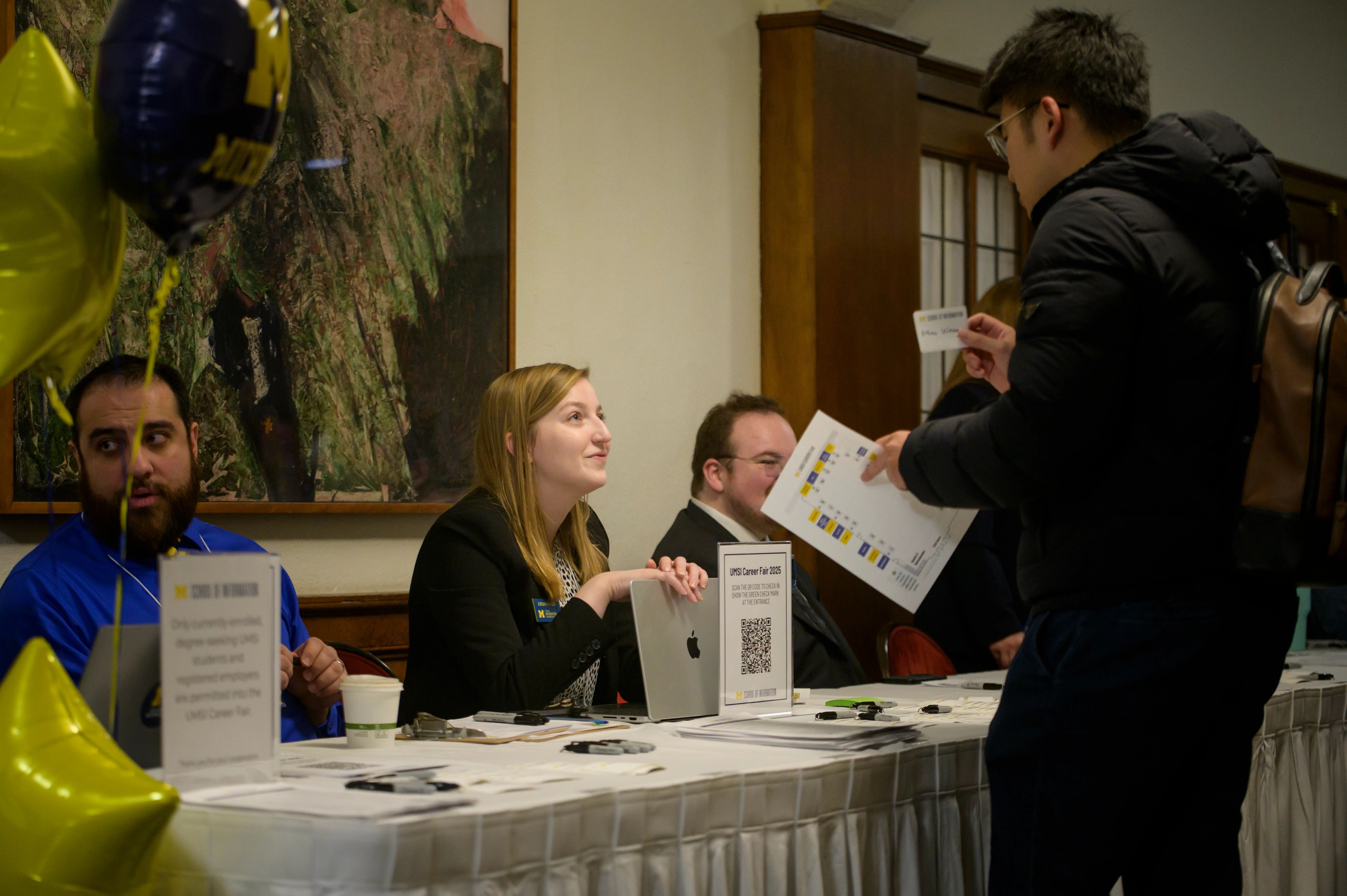 A student handing out resume.