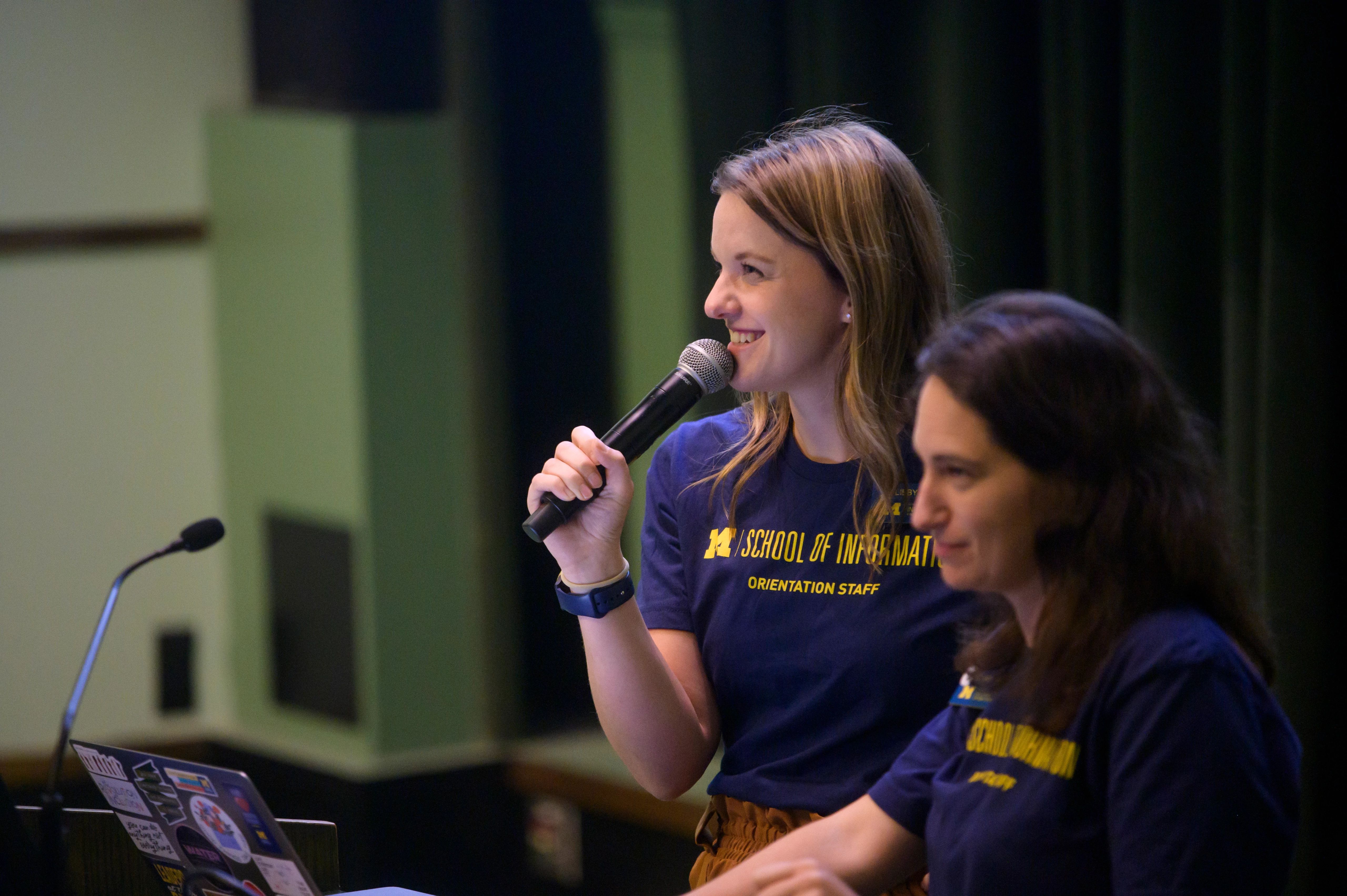 A student presenting with microphone.